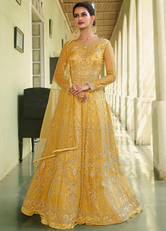 green emerald velvet dress Yellow Semi Stitched Net Long Ethnic Dress