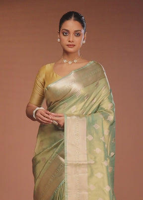 Green Tissue Silk Saree With Blouse Piece